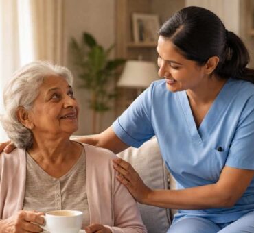 Caregiver assisting elderly dementia patient at home in a comfortable living room.